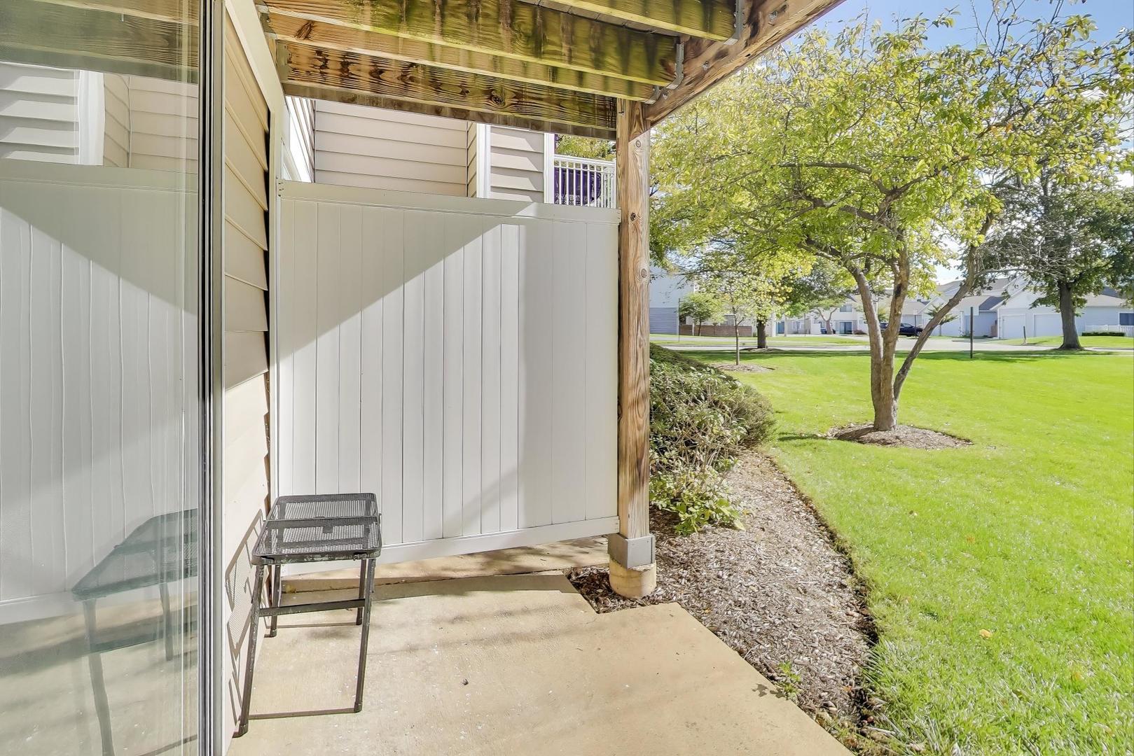 609 Hanover Court, Unit X1 Schaumburg, IL 60194 - Photo 19 of 25 a view of a pathway of a house with a backyard
