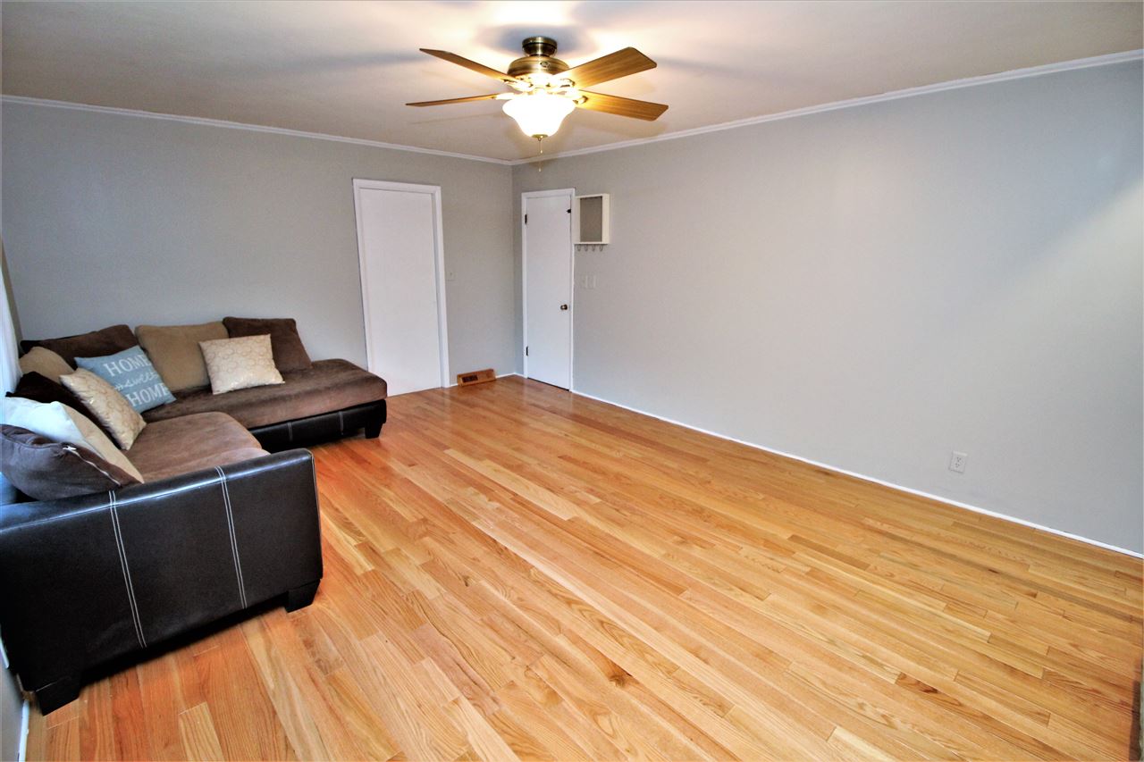 2104 Bradley Road Rockford, IL 61107 - Photo 8 of 25 a bedroom with a bed and a ceiling fan