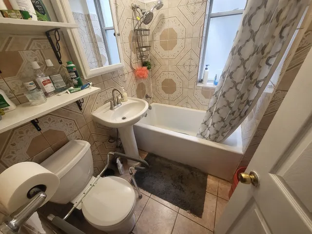 a bedroom with a bed and flat screen tv