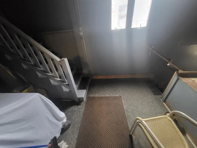 a room with water heater and racks