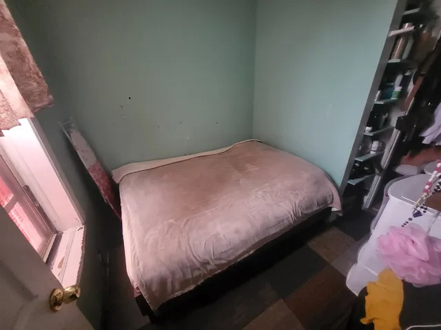 a room with window and closet