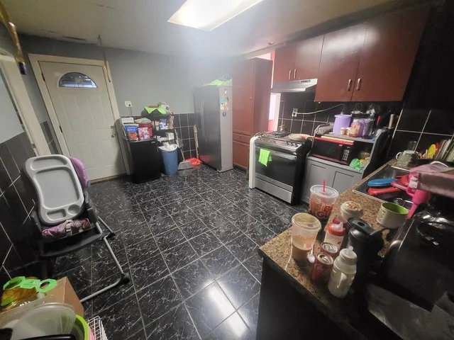 a view of a backyard with sitting area