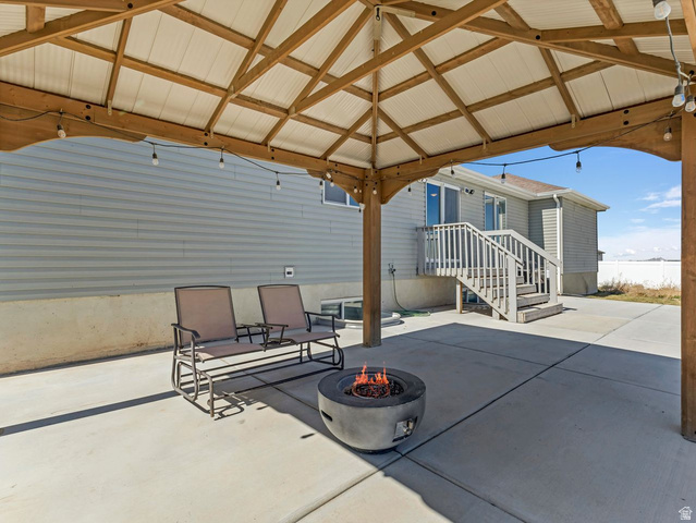 573 South Maxwell Drive Grantsville, UT 84029 - Photo 20 of 25 View of patio / terrace with an outdoor fire pit and a gazebo