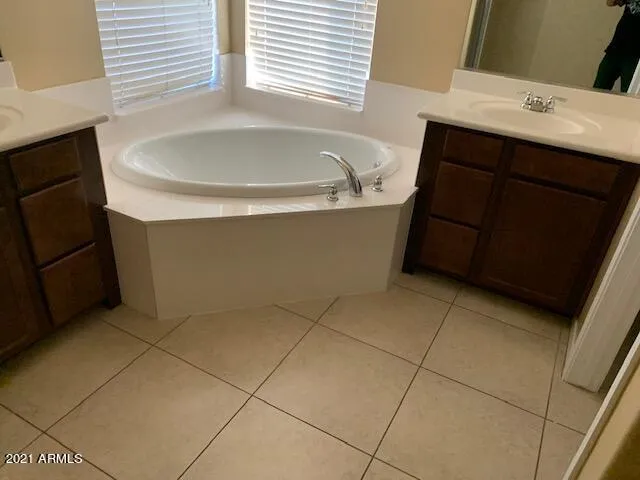 a bathroom with a bathtub and a sink
