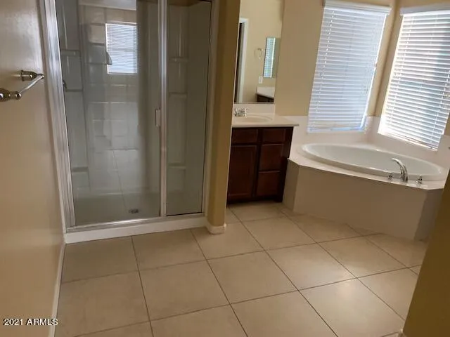 a bathroom with a bathtub and shower