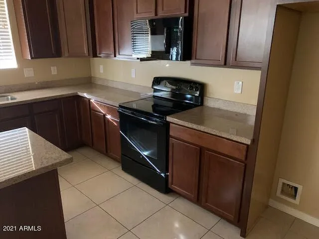 a kitchen with a stove and a microwave