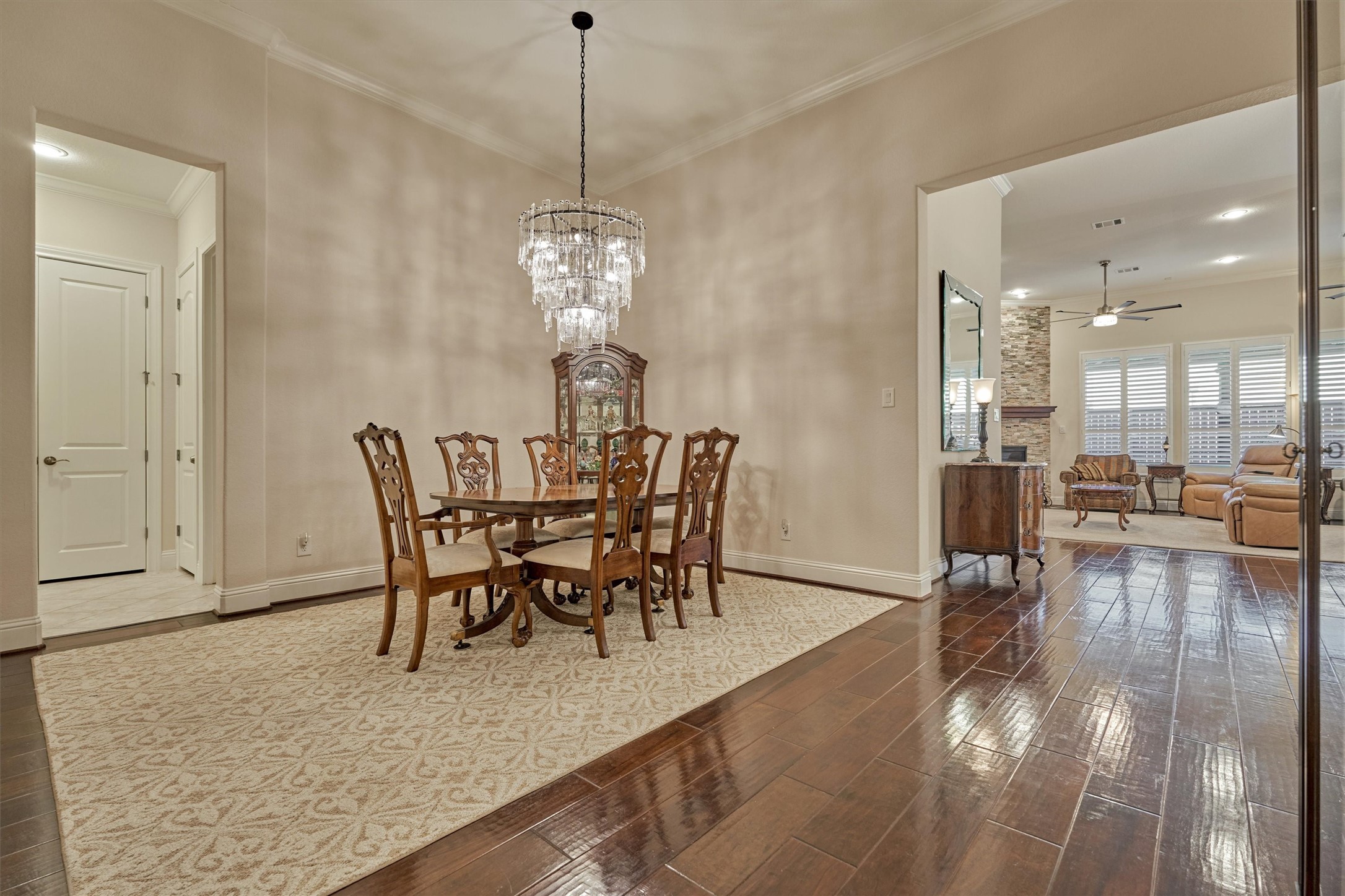 8827 Leaning Hollow Lane Spring, TX 77379 - Photo 17 of 49 Such an elegant formal dining room with wavy glass custom chandelier. Crown molding and hallway to half bath, laundry room and butler pantry.