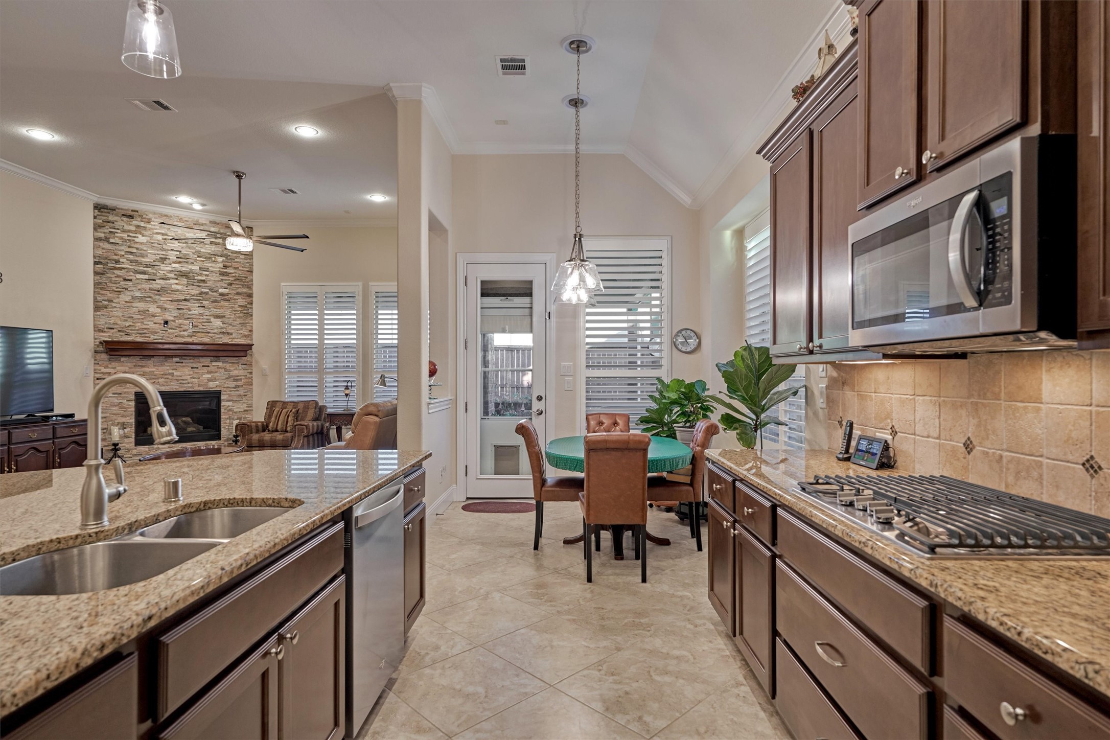 8827 Leaning Hollow Lane Spring, TX 77379 - Photo 26 of 49 don't miss the plantation shutters throughout. Love the pot and pan ddrawer below the cooktop.