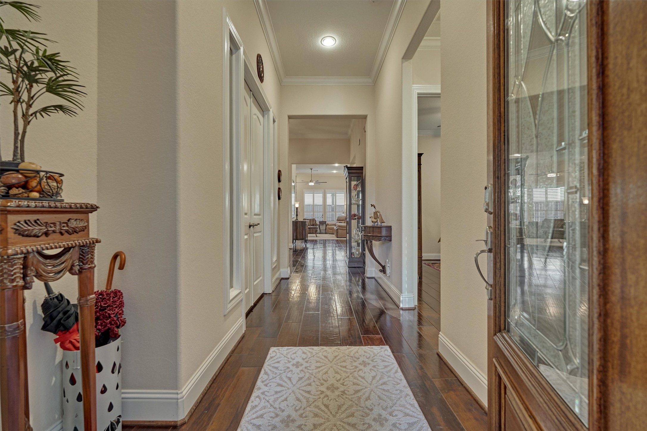 8827 Leaning Hollow Lane Spring, TX 77379 - Photo 8 of 49 Solid wood and etched glass front entry door. Wide plank wood floors throughout. Also crown molding in all rooms.