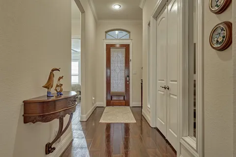 a very nice looking hallway with a wooden floor