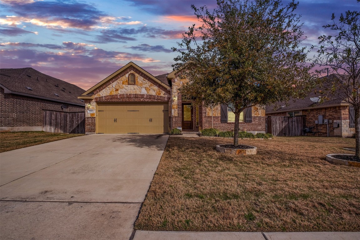 a front view of a house with a yard