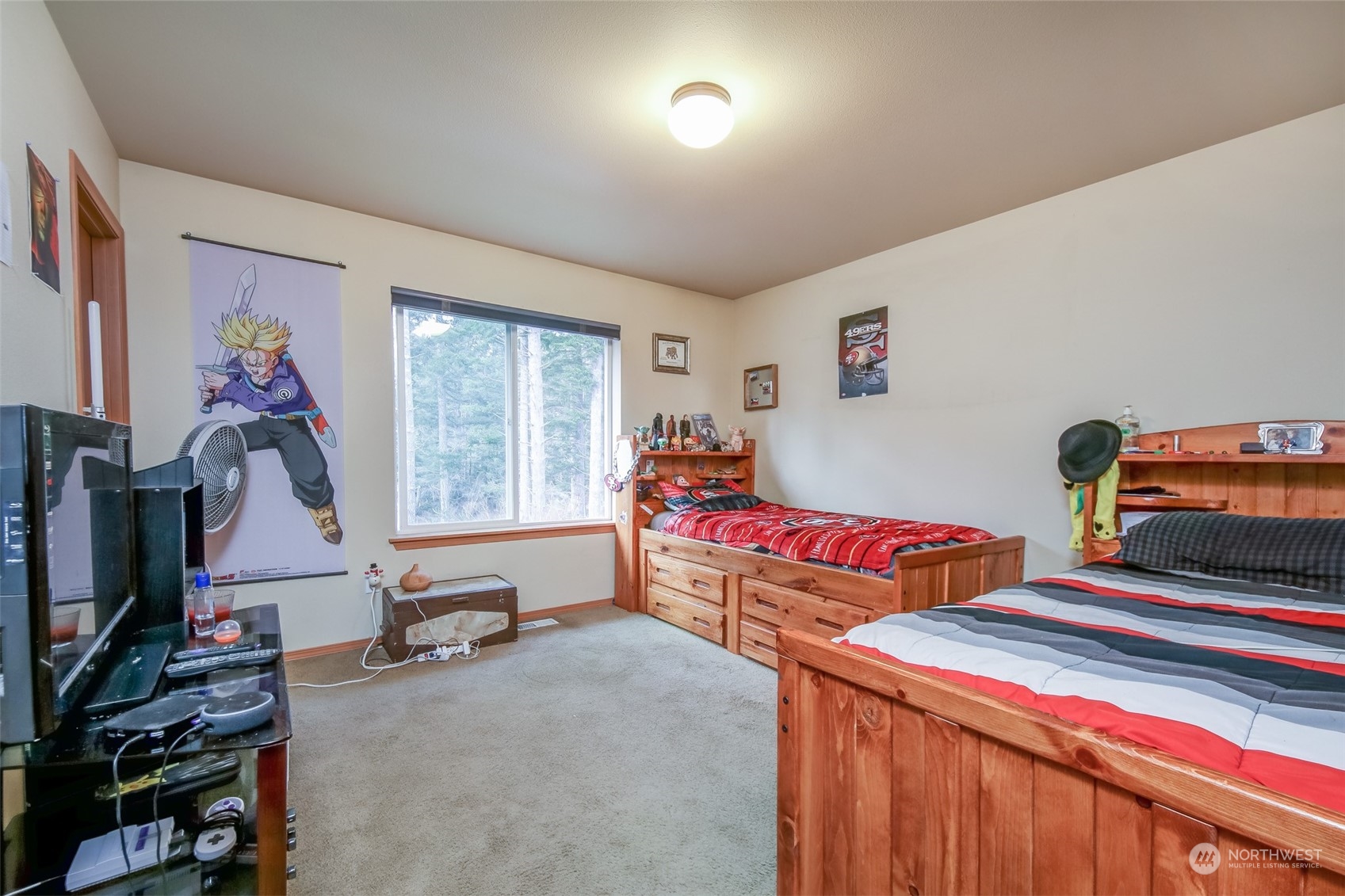4644 Chanting Circle Southwest Port Orchard, WA 98367 - Photo 13 of 26 a bedroom with furniture and a flat screen tv