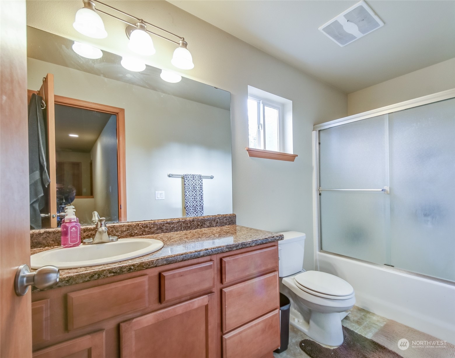 4644 Chanting Circle Southwest Port Orchard, WA 98367 - Photo 15 of 26 a bathroom with a granite countertop sink toilet and shower