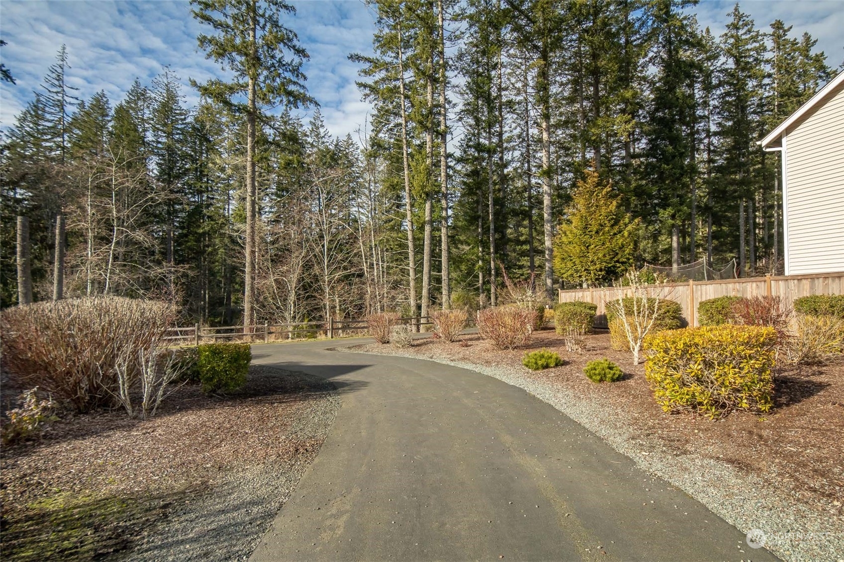 4644 Chanting Circle Southwest Port Orchard, WA 98367 - Photo 20 of 26 a view of a patio with table and chairs and potted plants