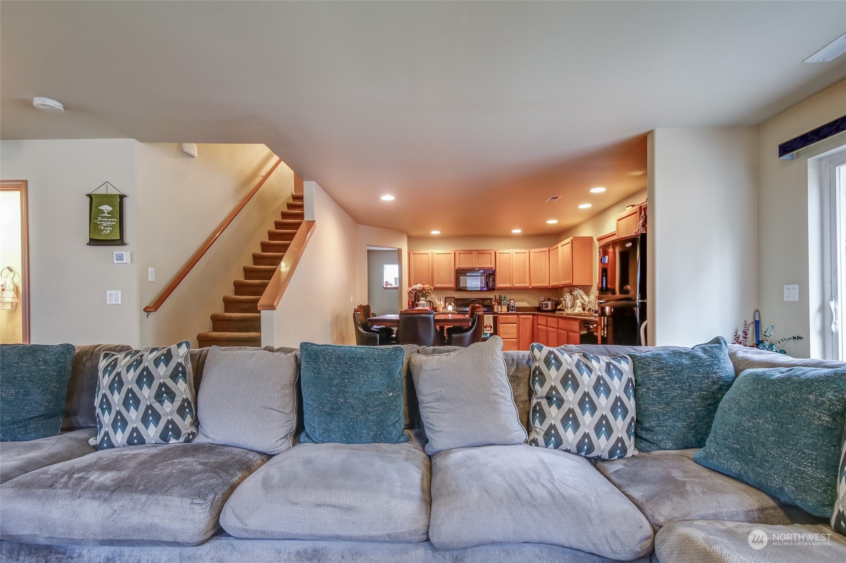 4644 Chanting Circle Southwest Port Orchard, WA 98367 - Photo 4 of 26 a living room with furniture and a large mirror with wooden floor