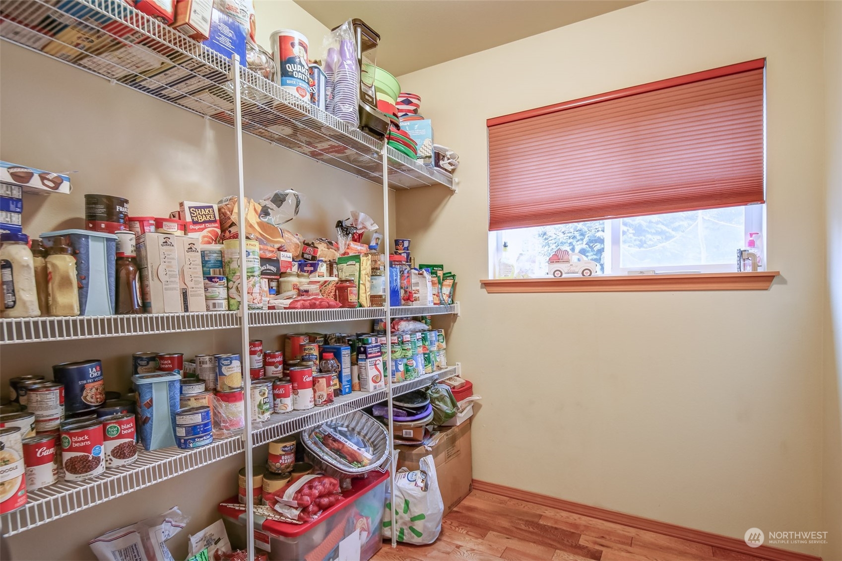 4644 Chanting Circle Southwest Port Orchard, WA 98367 - Photo 8 of 26 a store room with lots of storage and a white refrigerator