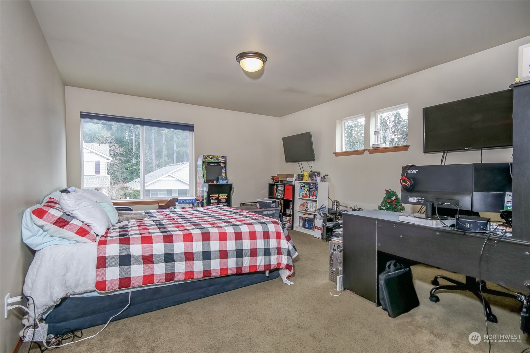 4644 Chanting Circle Southwest Port Orchard, WA 98367 - Photo 9 of 26 a bedroom with a bed and flat screen tv