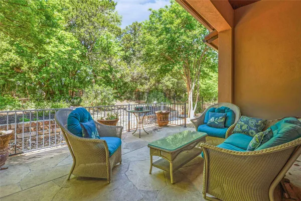 a view of a chairs and table in the patio