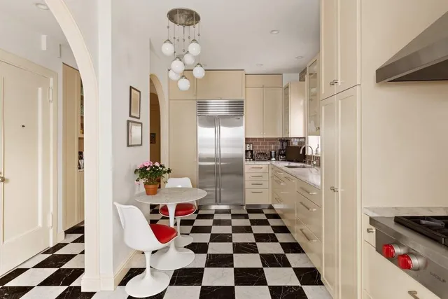 a kitchen with a sink stove and window