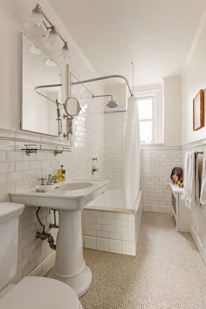 29 East 64th Street, Unit 4C Manhattan, NY 10065 - Photo 8 of 9 a bathroom with a sink toilet and shower