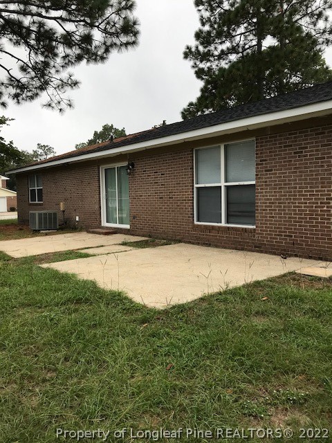 6932 Wickersham Road Fayetteville, NC 28314 - Photo 2 of 2 a house with trees in the background