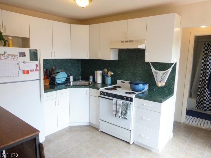 48 Vail Road Landing, NJ 07850 - Photo 11 of 23 a kitchen with a stove and a white refrigerator