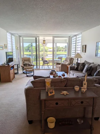 a bedroom with two beds and a window