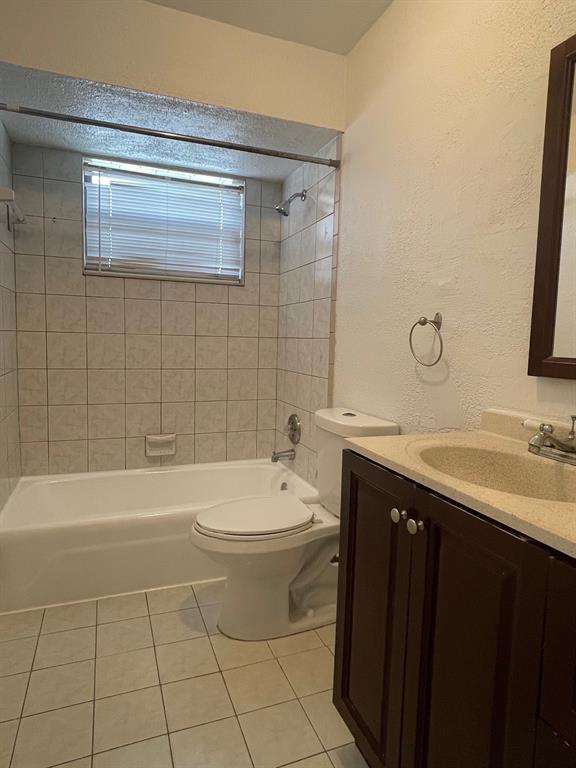 8510 Sunset Strip Sunrise, FL 33322 - Photo 11 of 21 a bathroom with a sink a toilet and bathtub