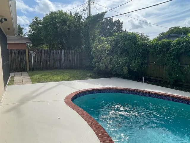 a view of a backyard with green space