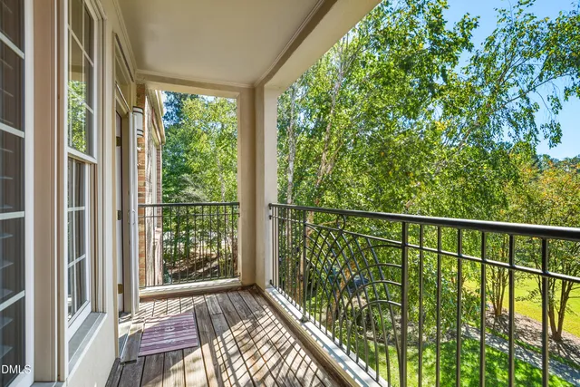 a view of balcony with wooden floor