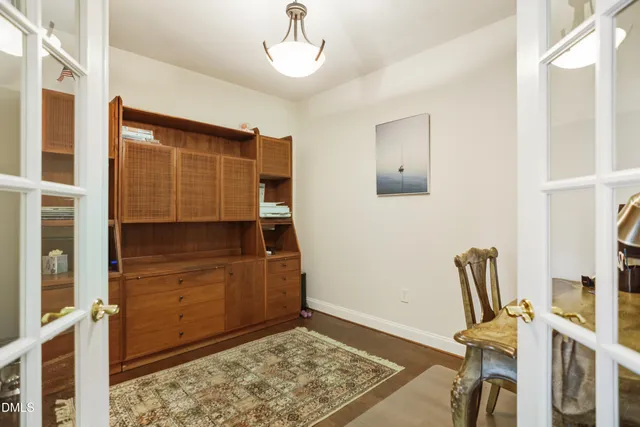 a view of workspace with furniture and wooden floor