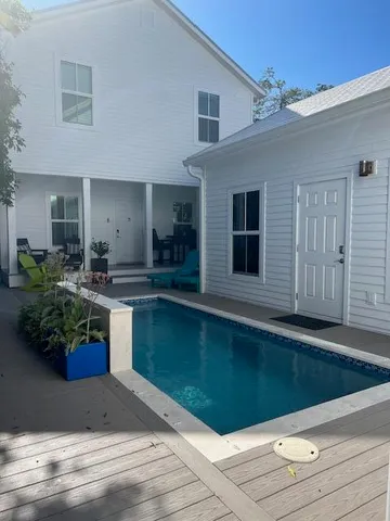a kitchen with a sink cabinets and entryway