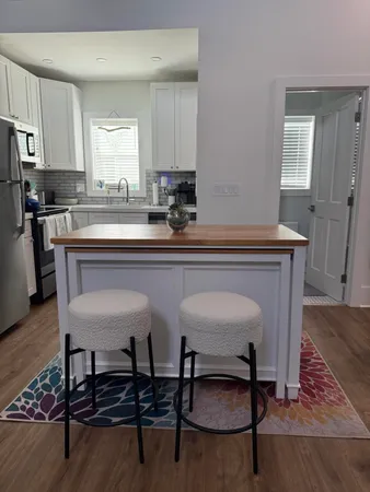 a kitchen with a dining table and chairs