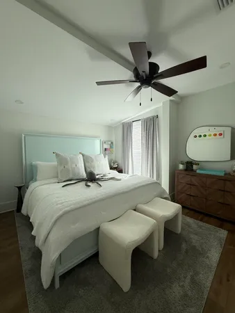 a bed room with a bed and a chandelier