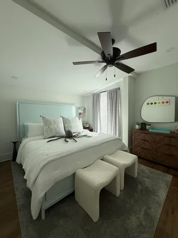 a bed room with a bed and a chandelier