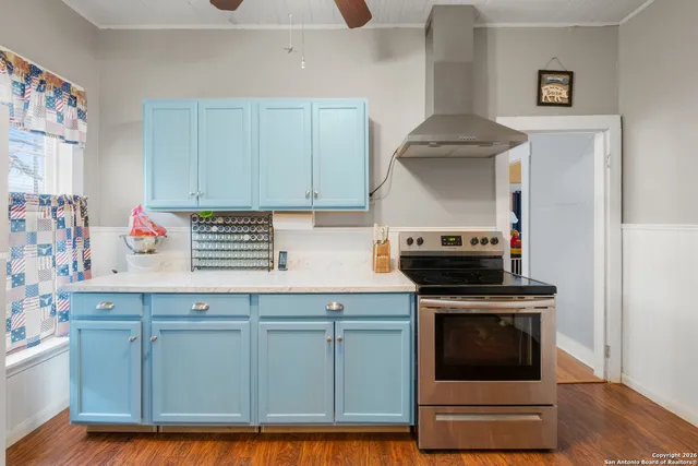 a kitchen with granite countertop a stove and a sink