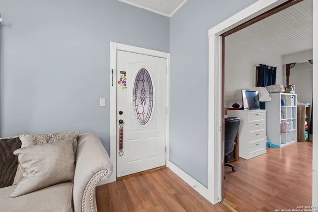 a view of a livingroom with furniture and wooden floor