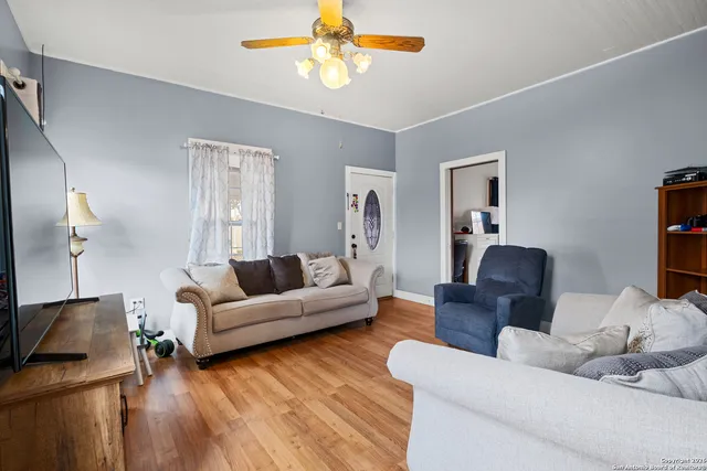a living room with furniture and a flat screen tv
