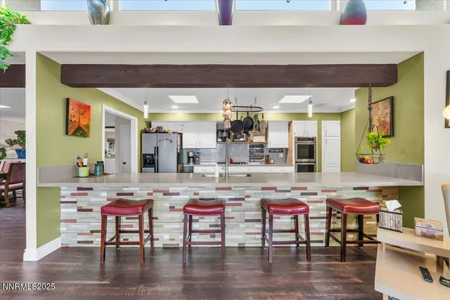 a dinning table and chairs in a room