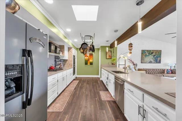 a large kitchen with stainless steel appliances granite countertop lots of counter top space