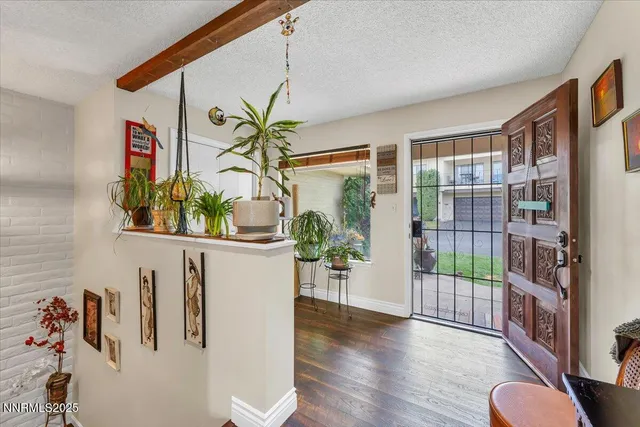a view of entryway with wooden floor