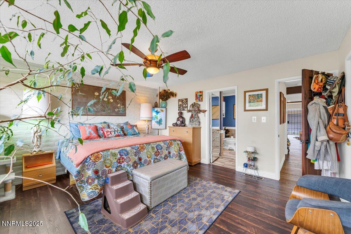 3415 Skyline Boulevard Reno, NV 89509 - Photo 25 of 49 a bedroom with bed and wooden floor