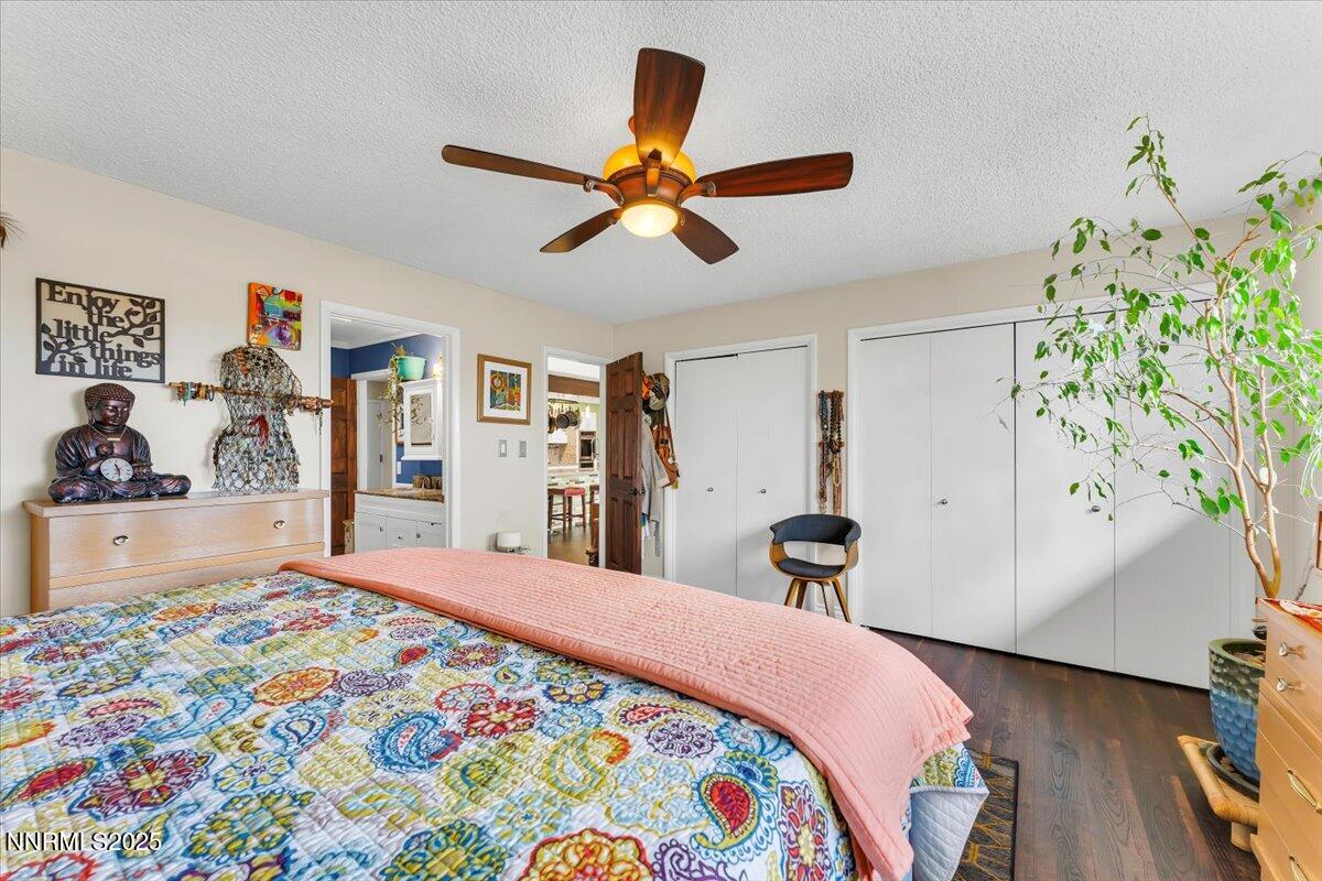 3415 Skyline Boulevard Reno, NV 89509 - Photo 26 of 49 a bedroom with a bed and a chandelier