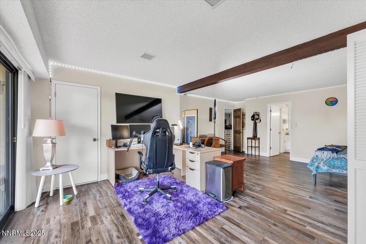 3415 Skyline Boulevard Reno, NV 89509 - Photo 32 of 49 a living room with furniture and a flat screen tv