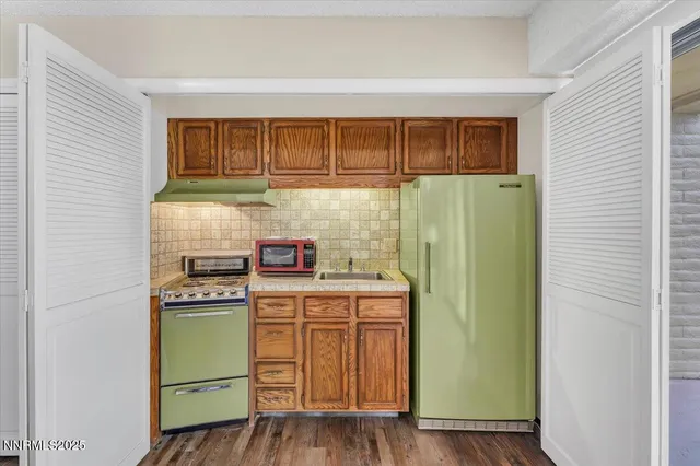 a bathroom with double vanity and a mirror