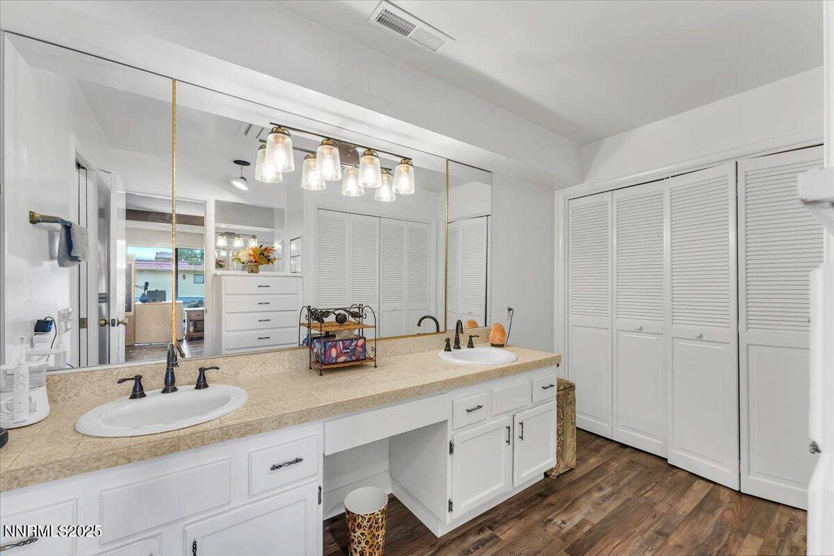 3415 Skyline Boulevard Reno, NV 89509 - Photo 35 of 49 a bathroom with double vanity and a mirror