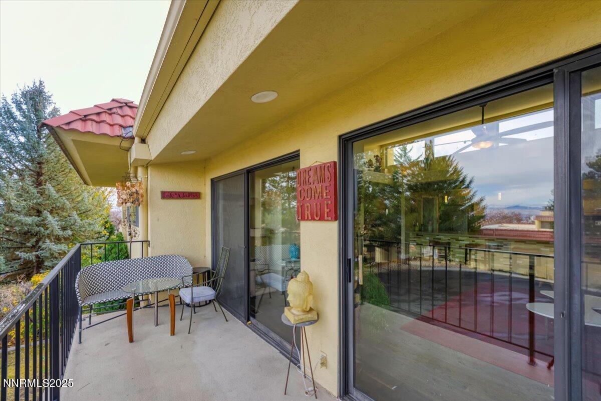3415 Skyline Boulevard Reno, NV 89509 - Photo 45 of 49 a view of a porch with chairs and backyard