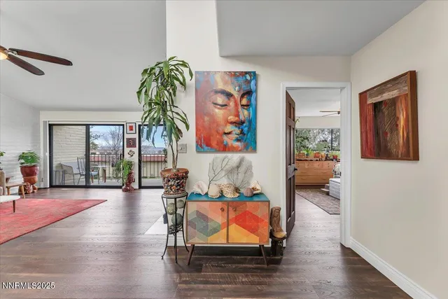 a living room with furniture window and wooden floor
