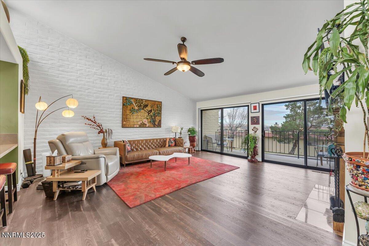 3415 Skyline Boulevard Reno, NV 89509 - Photo 7 of 49 a living room with furniture a flat screen tv and a large window