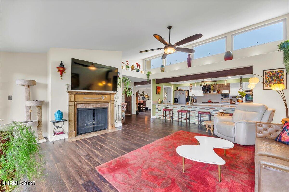 3415 Skyline Boulevard Reno, NV 89509 - Photo 9 of 49 a living room with furniture a fireplace and a flat screen tv